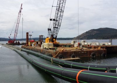 Barges and outfall pipe during marine outfall installation