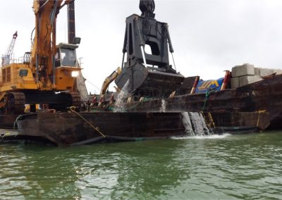 Excavator barge during marine trenching for the outfall