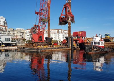 Piling barges and cranes at Victoria International Marina