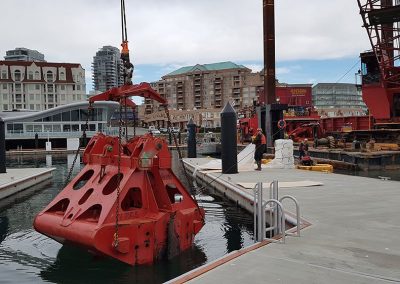 Dredging bucket on the dock at Victoria International Marina