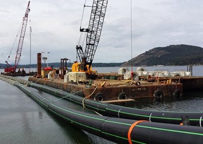 Marine outfall pipe and construction barges